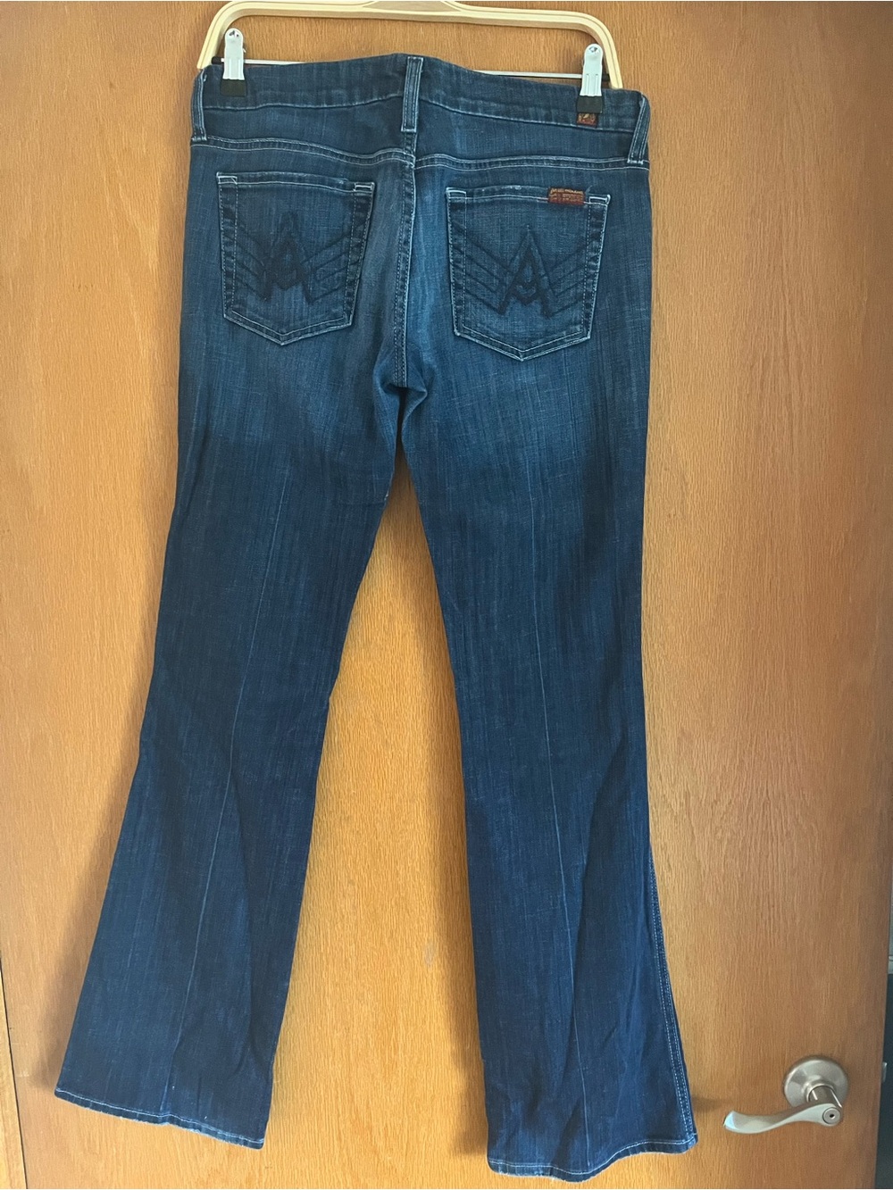 7 For All Mankind Dark Blue Flare Jeans, size 29, 33” Inseam.